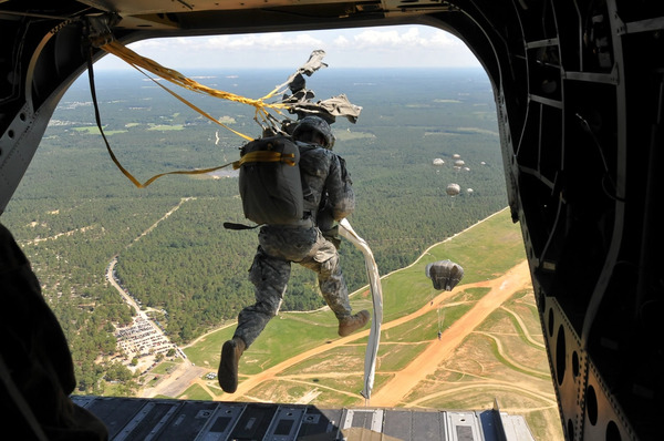 A devil paratrooper exits a CH-47. Photo by Staff Sgt. Juan F. Jiminez